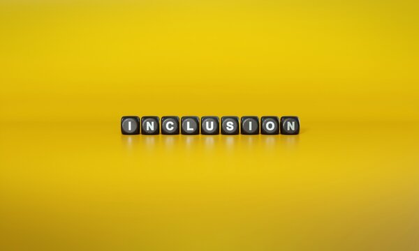 Word ‘Inclusion’ spelled out in white text on dark wooden blocks against plain yellow background. 3D rendering