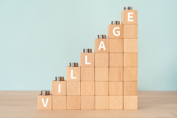 村のイメージ｜「VILLAGE」と書かれたブロックとコイン