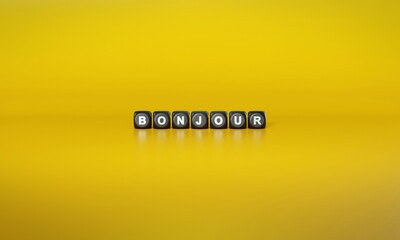 French word ‘Bonjour’ spelled out in white text on dark wooden blocks against plain yellow background. 3D rendering © HTGanzo
