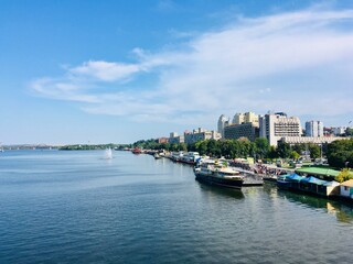 Obraz premium Summer view from the bridge to the city of Dnipro