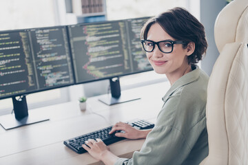 Photo of young professional web-designer woman creating new website write scripts coding in office...