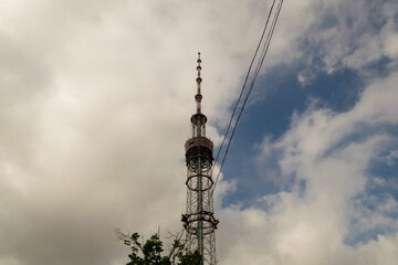 Fototapeta na wymiar Communication tower with antenna and satellite dish telecom network on blue sky background