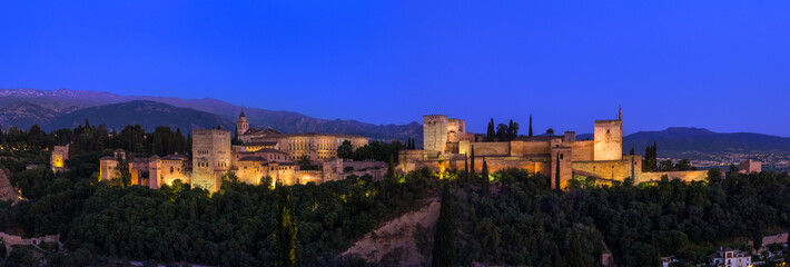 Fototapeta na wymiar Panorama view of the Alhambra Palace on the hill top in the blue hour time, Granada Spain