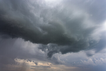 Storm clouds over field, extreme weather, dangerous storm