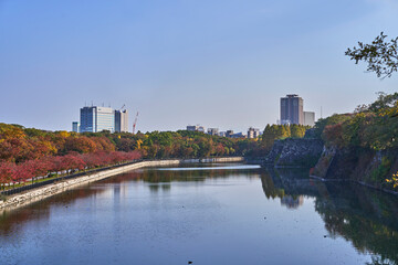 Fototapeta na wymiar Osaka Castle Park at Autumn Sunset