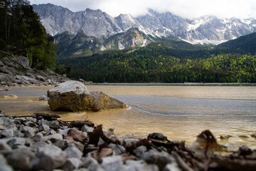 Pollen on the water at the shoreline.