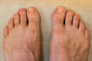 Top view of an adult man's feet.
