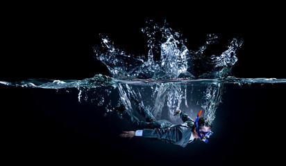 Funny businessman swimming underwater . Mixed media - obrazy, fototapety, plakaty