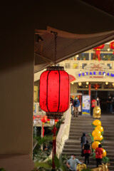  lanterns is hanging beside the wall in the building 