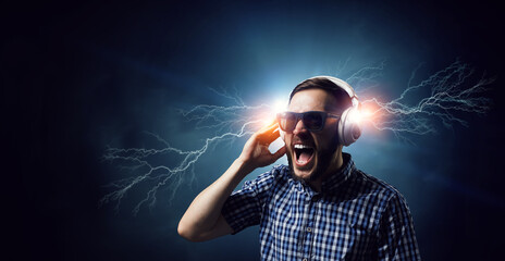 Young man with headphones . Mixed media