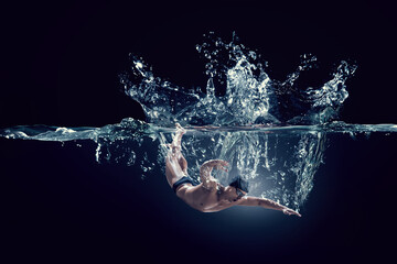 Professional man swimmer on a wave