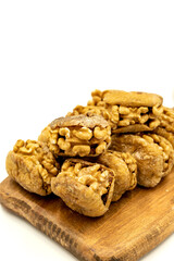 Stuffed dried figs. Dried figs stuffed with walnuts isolated on white background. Close-up. local name cevizli incir