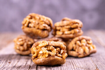Stuffed dried figs. Dried figs stuffed with walnuts on a wood floor. Close-up. local name cevizli incir