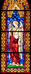 VALENCIA, SPAIN - FEBRUAR 16, 2022: The archangel Raphael on the stained glass of church Iglesia de...