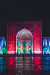 Registan square in Samarkand lit in colourful lights, Uzbekistan