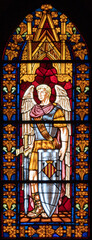 VALENCIA, SPAIN - FEBRUAR 16, 2022: The archangel Michael on the stained glass of church Iglesia de Santa Catalina form 20. cent.
