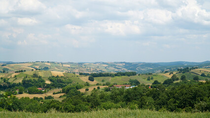 Fototapeta na wymiar landscape with green hills and blue sky