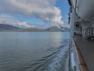 Breathtaking landscape and scenery with mountains, glaciers and fjords on misty day during cruising...