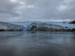 Breathtaking landscape and scenery with mountains, glaciers and fjords on misty day during cruising...