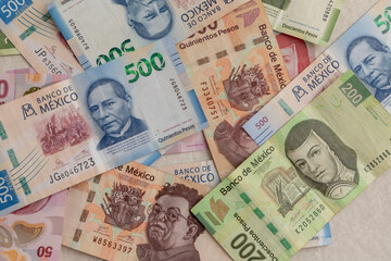 Background of banknotes of different values - obrazy, fototapety, plakaty