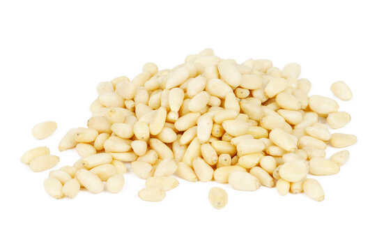 Pine nuts on a white background. Healthy vegetarian snack.