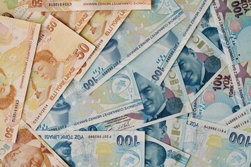 fifty and hundred turkish lira banknotes as a background.