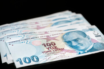 hundred turkish lira banknotes isolated on black background. Turkey currency