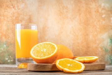 glass of fresh natural orange juice on table
