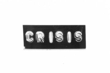 Black color banner that have embossed letter with word crisis on white paper background