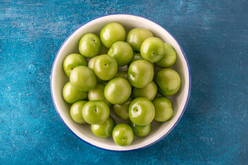 top view delicious ripe green plum fruits on table