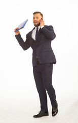 Fototapeta premium young businessman in a suit and with a blue folder without inscriptions and a phone posing with different emotions on a white background in the studio isolated in full growth