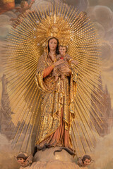VALENCIA, SPAIN - FEBRUAR 17, 2022: The carved polychrome statue of Madonna in the church Iglesia del Santo Angel Custodio from 19.cent. © Renáta Sedmáková