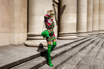Spring, summer fashion. High fashion model. Glamour, stylish elegant woman. female model in colorful dress in the city. Travel model. Outdoor shoot. Casual, urban style. Vogue.