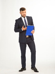 young businessman in a suit and with a blue folder without inscriptions posing with different emotions on a white background in the studio isolated in full growth