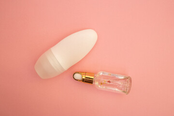 Roller deodorant antiperspirant on a pink background