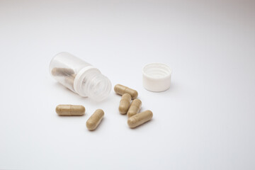 Pills with the badas, dietary supplement on a white background