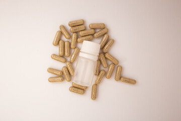Pills with the badas, dietary supplement on a white background