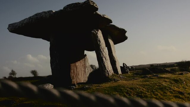 A Dolmen in Ireland on a clear spring day. Back lit with strong shadows.