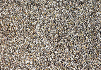 Small pebbles of crushed stone as an abstract background.