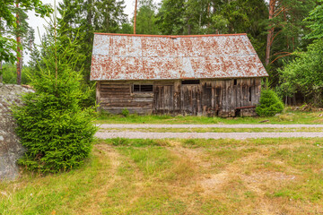 Old barn at the forest edge
