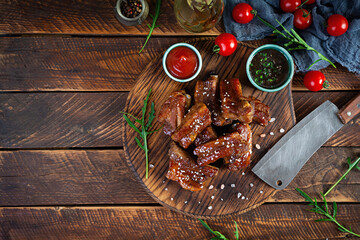 Grilled sliced ribs in sweet and sour sauce. Ribs marinated in honey sauce with herbs. Top view