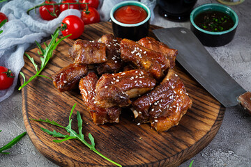 Grilled sliced ribs in sweet and sour sauce. Ribs marinated in honey sauce with herbs