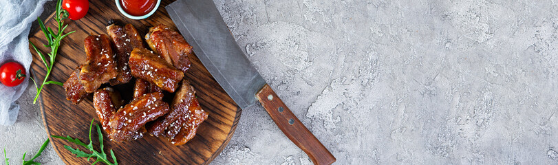 Grilled sliced ribs in sweet and sour sauce. Ribs marinated in honey sauce with herbs. Top view