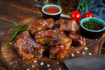 Grilled sliced ribs in sweet and sour sauce. Ribs marinated in honey sauce with herbs