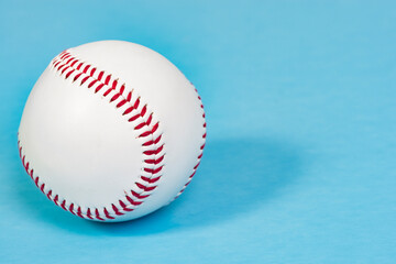 Baseball with a shallow depth of field isolated on blue with copy space