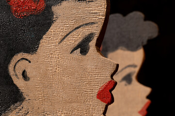 1920's hand made and painted wooden female head cut outs with red flower and lipstick vintage poster girl