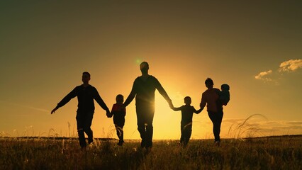 Family game father mother daughter son fun boogut holding hands. Childhood dream to fly on plane, mom dad little kids, outdoors. Happy family team, children, parents, run together in sun in park