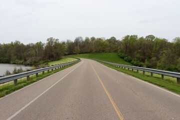 The empty road in the country on a cloudy day.