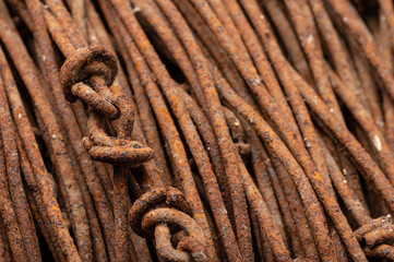 Rusty wire, john deere green patina with metal gears and close up macro of rusty steel bolts and paint