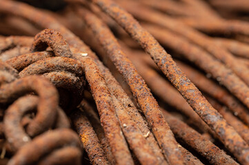 Rusty wire, john deere green patina with metal gears and close up macro of rusty steel bolts and paint
